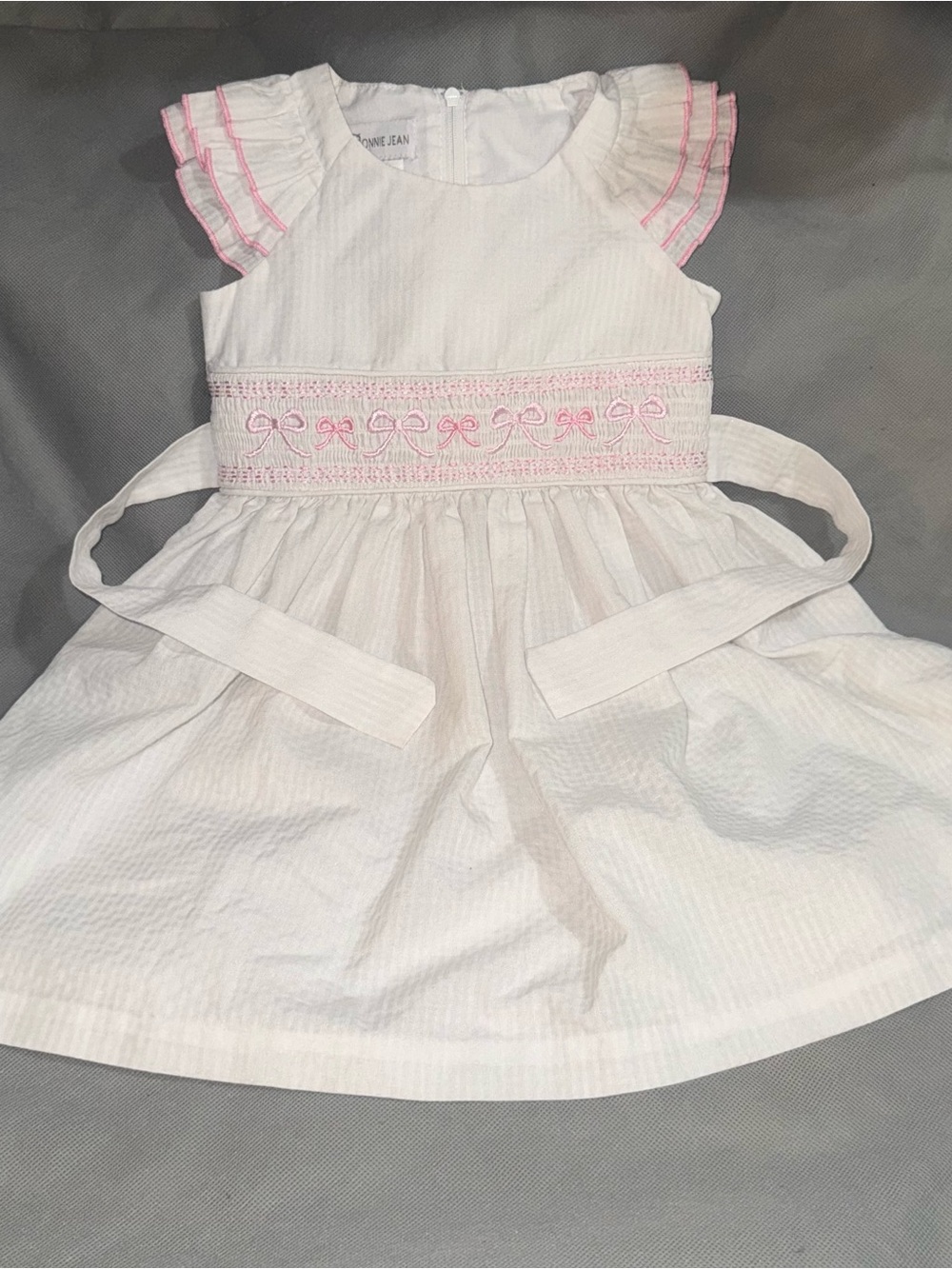 Bonnie Jean White Seersucker Smocked Dress with Pink Bows